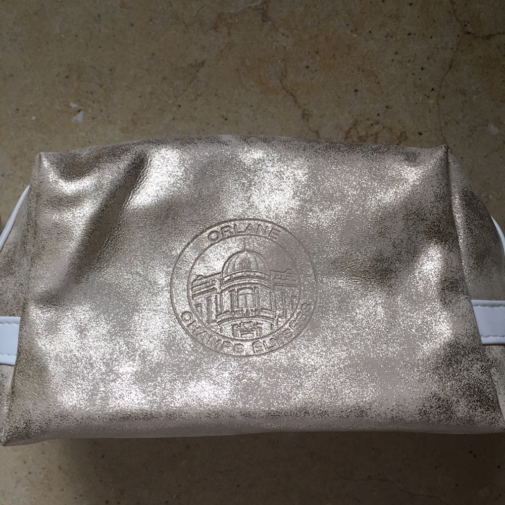 Gold distressed Orlane Paris makeup/cosmetic bag